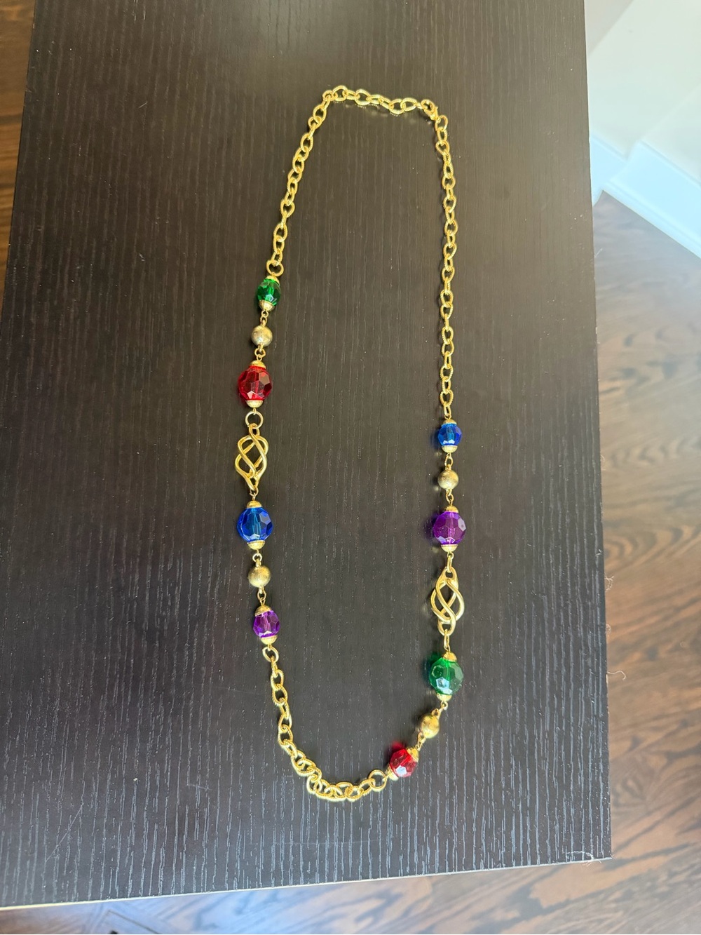 Vintage gold-tone chain necklace featuring multicolored faceted crystals